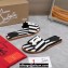 Christian Louboutin timeless CL mules in striped fabric Black 2024