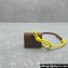 Miu Miu Leather, cord, and metal trick with mini-pouch bag 5TL515 Cognac/Yellow 2024