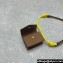 Miu Miu Leather, cord, and metal trick with mini-pouch bag 5TL515 Cognac/Yellow 2024