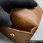 Miu Miu Leather, cord, and metal trick with mini-pouch bag 5TL515 Cognac/Yellow 2024