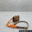 Miu Miu Leather, cord, and metal trick with mini-pouch bag 5TL515 Cognac/Orange 2024