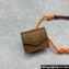 Miu Miu Leather, cord, and metal trick with mini-pouch bag 5TL515 Cognac/Orange 2024
