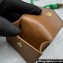 Miu Miu Leather, cord, and metal trick with mini-pouch bag 5TL515 Cognac/Green 2024