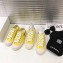 Chanel Logo Print Canvas Sneakers Yellow 2019